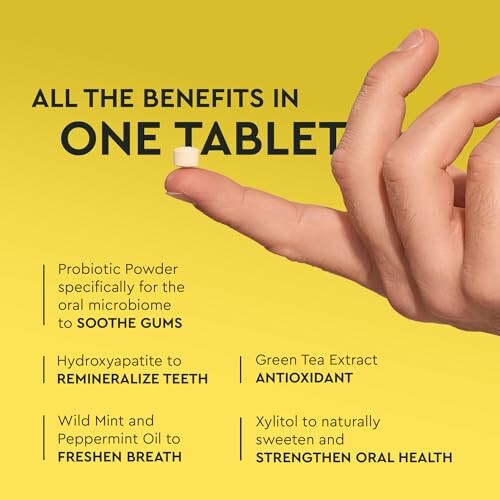 Hand holding a tablet with oral health benefits listed.